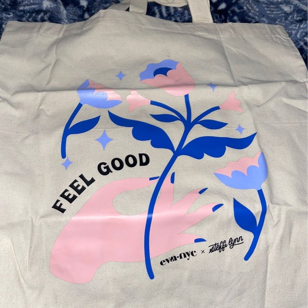 Unique Eva nyc tote and holographic rose spray